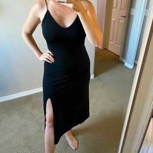 Black midi dress with side slit.